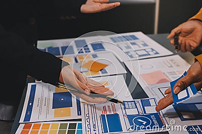 The designer team is designing the uxui system to make the uxui system work well on new phones and support system updates. Website Stock Photo