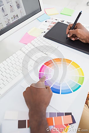 Designer using colour wheel and digitizer Stock Photo