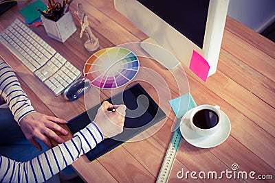 Designer using digitizer on desk Stock Photo