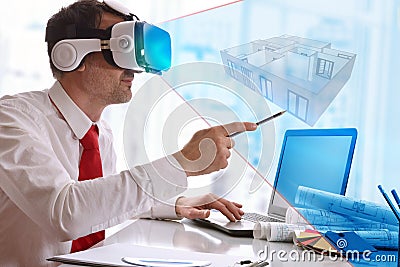 Designer visualizing 3d plane in virtual reality glasses in the Stock Photo