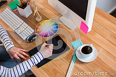 Designer working with colour wheel and digitizer Stock Photo