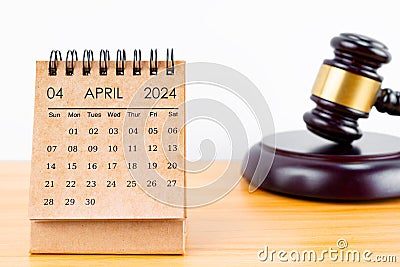Desk calendar for April 2024 and judge's gavel Stock Photo