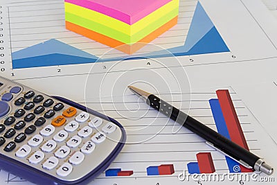 Desk with financial charts and histograms Stock Photo