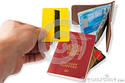 Desk of frequent traveler - angle view. The composition of essential items for trip: passport with multiple entry stamps, foreign Stock Photo