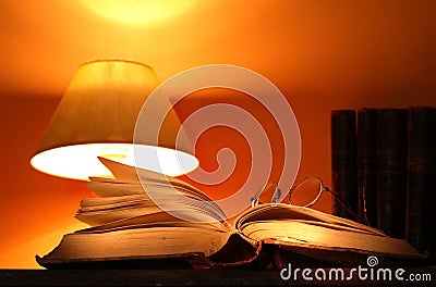 Desk Lamp And Old Books Stock Photo