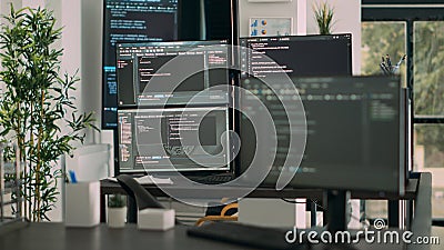 Desk with multiple screens showing digital programming network Stock Photo