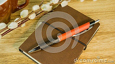 Desk with notepad, ballpoint pen Stock Photo