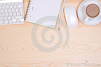 Desk with notepad, keyboard, mouse, pencil and a cup of coffee Stock Photo