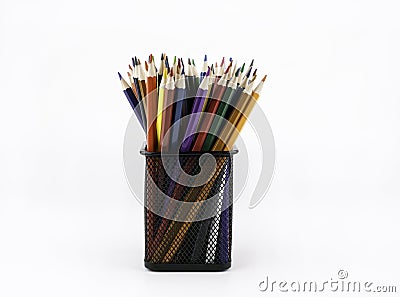 Desk organizer filled with colored pencils isolated on white background Stock Photo