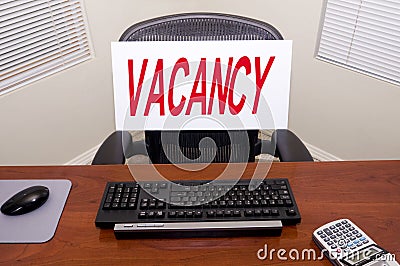 Desk and Vacancy Sign Stock Photo