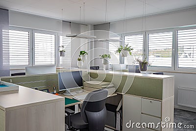 Desks are located in a modernly furnished office Stock Photo