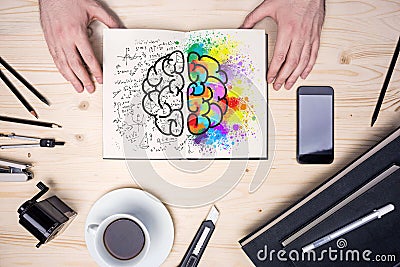 Desktop with brain sketch Stock Photo