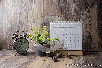 Desktop Calendar 2019 and vintage clock place on wooden office desk.Calender for Planner timetable,agenda appointment,organization Stock Photo