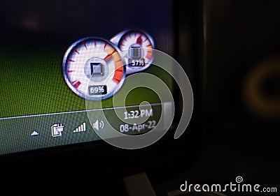 Desktop task bar showing time, date and battery with CPU and ram usage details Stock Photo