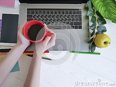 Desktop top view female hands job white wooden designer coffee cup Stock Photo