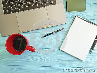 Desktop top view laptop blue wood desktop Stock Photo