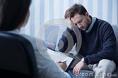 Despair man during therapy Stock Photo