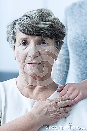 Despair senior woman Stock Photo