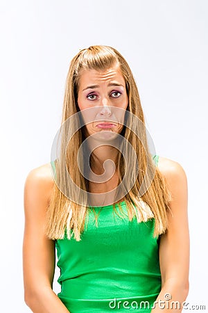 Despair young woman in green tanktop Stock Photo