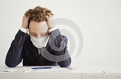 Despairing Businessman in Face Mask. Lockdown Coronavirus Stock Photo