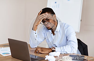 Desperate african american manager suffering from crisis Stock Photo