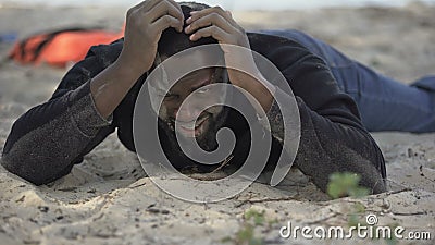 Desperate Afro American Man Crying On Shore Victim Of Crash Natural