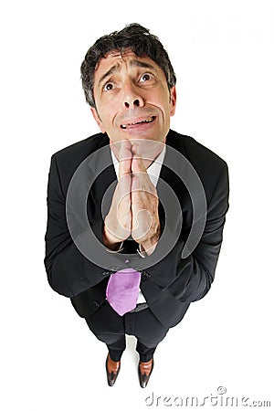 Desperate businessman praying Stock Photo