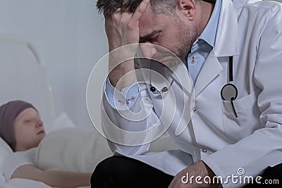 Desperate doctor and young patient Stock Photo