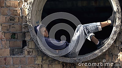 Desperate lonely male teen thinking of problem abandoned building, difficulties Stock Photo