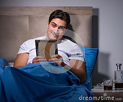 Desperate man divorced in bed Stock Photo