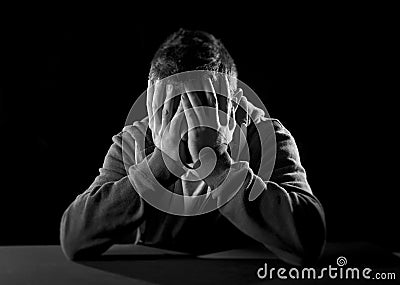 Desperate man suffering emotional pain, grief and deep depression Stock Photo