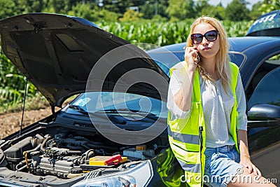 desperate woman calling the rescues for the car Stock Photo