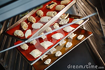 dessert baking on baking trays in the oven Stock Photo