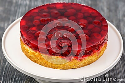 Dessert biscuit cake with cream and cherries in jelly Stock Photo