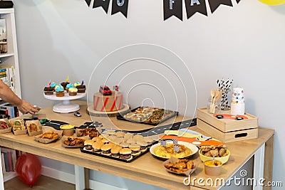 Dessert, chocolate and sweet cake food with toy cars on a birthday party decoration Stock Photo