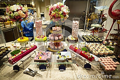 Dessert corner in a restaurant which offers buffet dinner Stock Photo