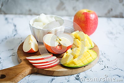 Dessert fruits: apples, mango and melon Stock Photo