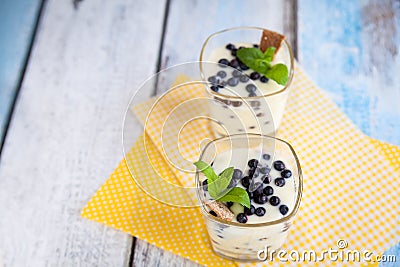 Dessert with natural yogurt, lemon curd and blueberries Stock Photo