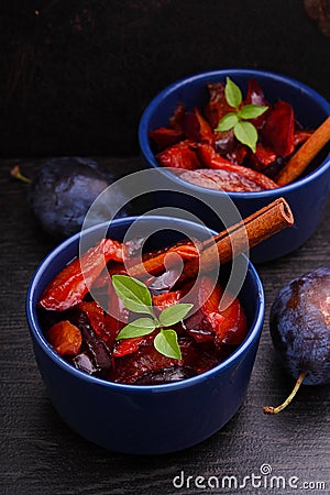 Dessert, stewed plums Stock Photo
