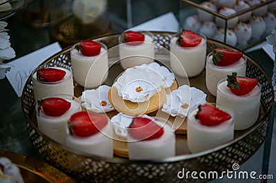 Dessert table for a party Candy bar. Rich thematic wedding candy bar, high variety of sweets Stock Photo