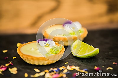 Dessert Tartlets and delicious cream Stock Photo