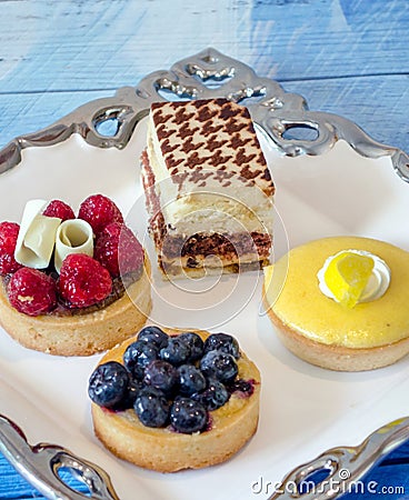 Dessert tray of special decedent tarts and cakes Stock Photo