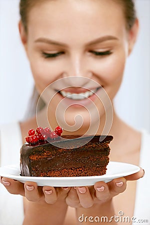 Dessert. Woman Eating Chocolate Cake Stock Photo