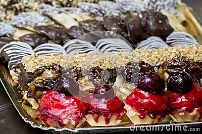 Different types of deserts on a paper plate Stock Photo