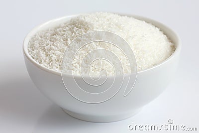 Dessicated coconut in white ceramic bowl Stock Photo
