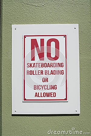 Destin, Florida- Close-up of a signage with No Skateboarding, Rollerblading, or Bicycling Allowed Stock Photo