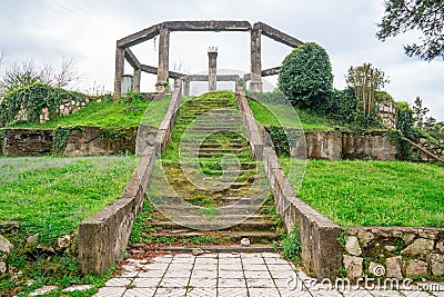 Destroyed building in the park of Poti, steps with grass, Georgia Stock Photo