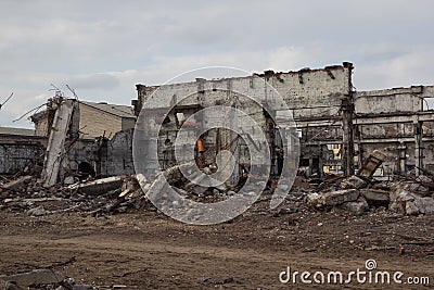 Destroyed industrial buildings, can be used as demolition, war, bomb, terrorist attack, earthquake or any other disaster concept Stock Photo