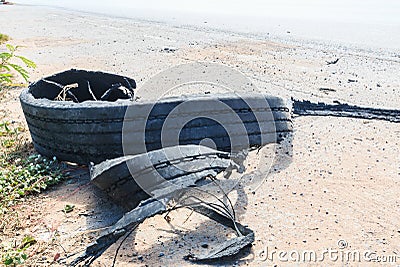 Destroyed rubber tire Stock Photo