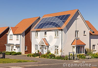 Detached new build home with solar panels on the roof. UK Editorial Stock Photo